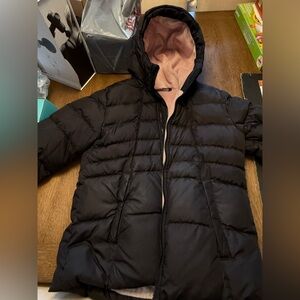 The North Face Kids down insulated waterproof hooded coat.
